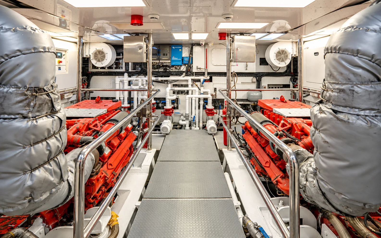 The engine room, with the two original Scania diesels either side of the walkway
